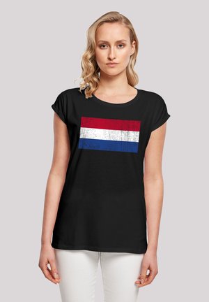 Black t-shirt featuring a distressed Dutch flag design with red, white, and blue horizontal stripes at the center. Short sleeves, relaxed fit.