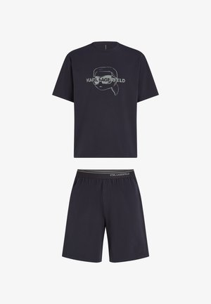 Tengerészkék pamut rövidujjú póló és hozzá illő sort, amelyen egy sziluett arc grafika és a márkaneve látható a mellkason.