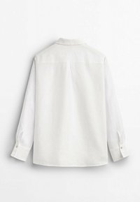 White long-sleeve shirt with a collared neck, button cuffs, and a smooth linen texture. Features a back yoke and a relaxed fit.