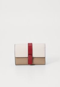 Leather wallet in beige and white, featuring a red accent strap. Textured surface, fold-over design, and rounded clasp detail.