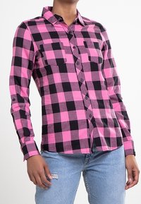 Pink and black plaid button-up shirt with a collar and two chest pockets; long sleeves with buttoned cuffs; soft fabric texture.