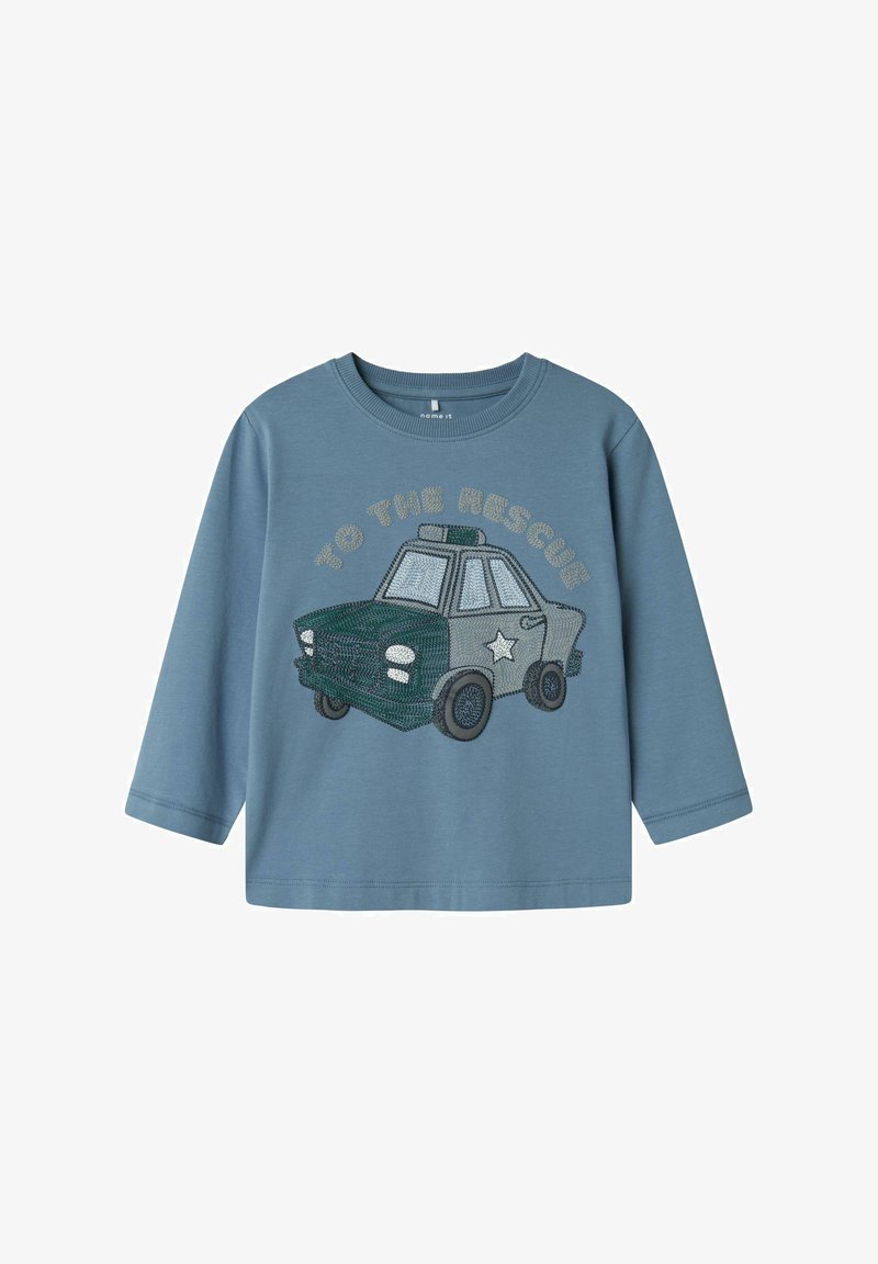 Light blue long-sleeve shirt featuring green and gray embroidered police car design with the text "TO THE RESCUE" above it.