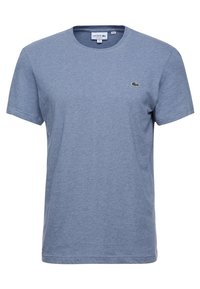Blue cotton t-shirt with a round neckline and short sleeves. Features a small green Lacoste logo on the chest. Soft texture, casual fit.