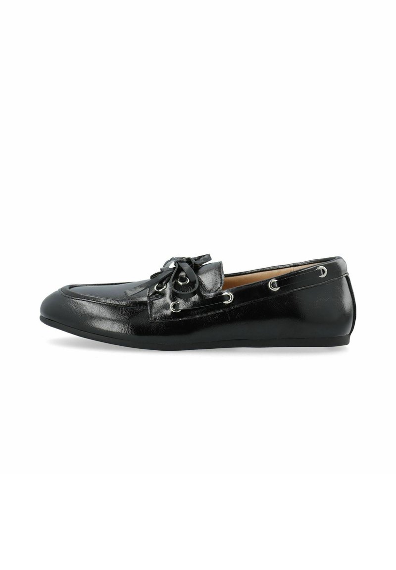 Black leather moccasin shoe with a smooth texture, rounded toe, decorative bow, and silver eyelet accents along the sides.