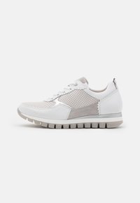 Sneakers with a white and light grey color scheme, featuring perforated design, smooth leather, suede accents, and rubber sole with ridges.
