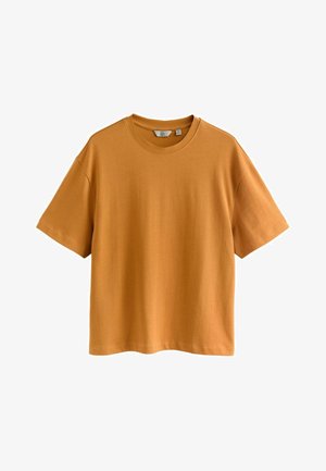 Short-sleeve T-shirt in mustard yellow cotton. Relaxed fit with a round neckline and smooth texture. Simple design, no patterns or accents.