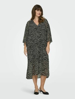 Robe à motifs noir et blanc, coupe ample, décolleté en V, longueur mi-mollet, tissu transparent, avec des manches larges et une silhouette fluide.