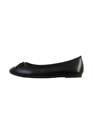 Black ballet flat shoe with rounded toe, small bow on front, and low heel, shown from side on white background.