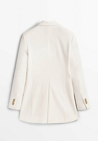 Hvid skræddersyet blazer med lange ærmer, slå-krave og dobbelte bagventiler. Har guldbuttons detaljer på ærmeafslutningerne.