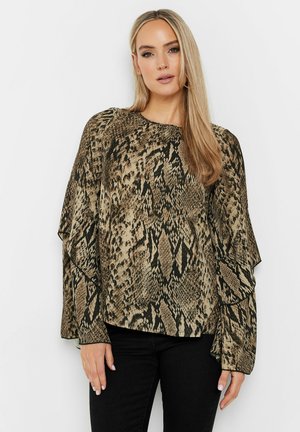 Langærmet bluse i slangeskindsprint med en beige og sort farveskema. Har svungne ærmer og let tekstur.