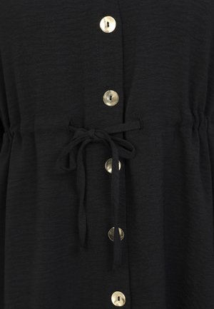 Black fabric garment with a drawstring waist, featuring large round gold buttons along the front and a soft, textured finish.