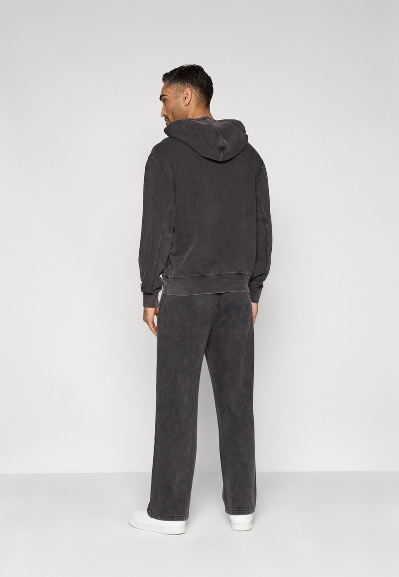 Champion ICONS WASH LOOSE STRAIGHT HEM PANTS - Teplákové kalhoty - black