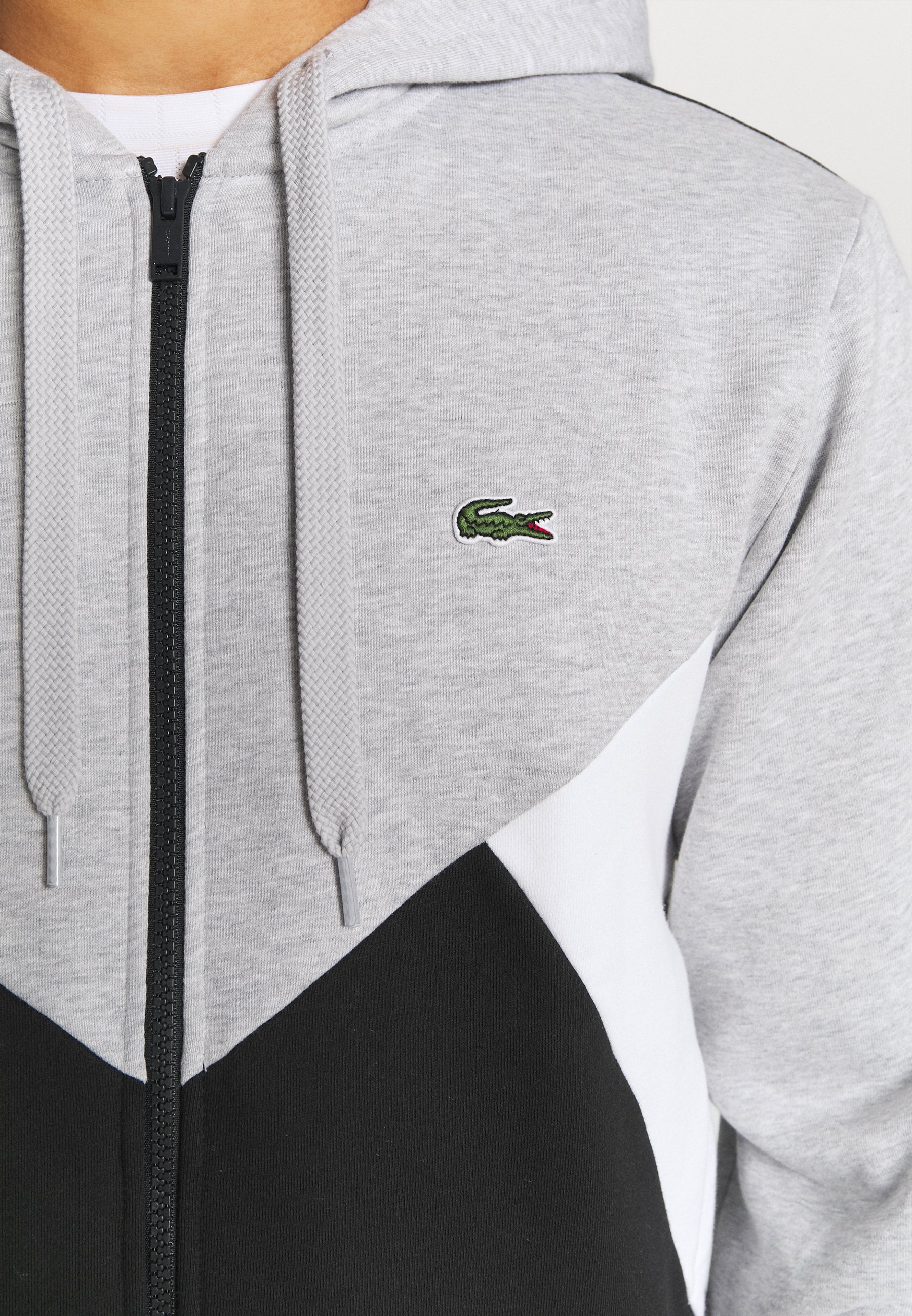 pull lacoste noir et blanc