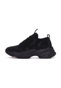 Black athletic shoe featuring a knitted upper with shiny speckles, a padded collar, and a sturdy, textured rubber sole.