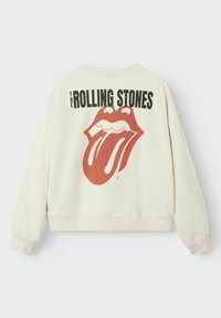Kremowy sweter z dużym czerwonym logo Rolling Stones z motywem języka. Posiada ściągacze na rękawach i u dołu.