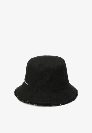 Black denim bucket hat with a frayed brim, featuring white logo detailing, cylindrical shape, and a textured fabric surface.