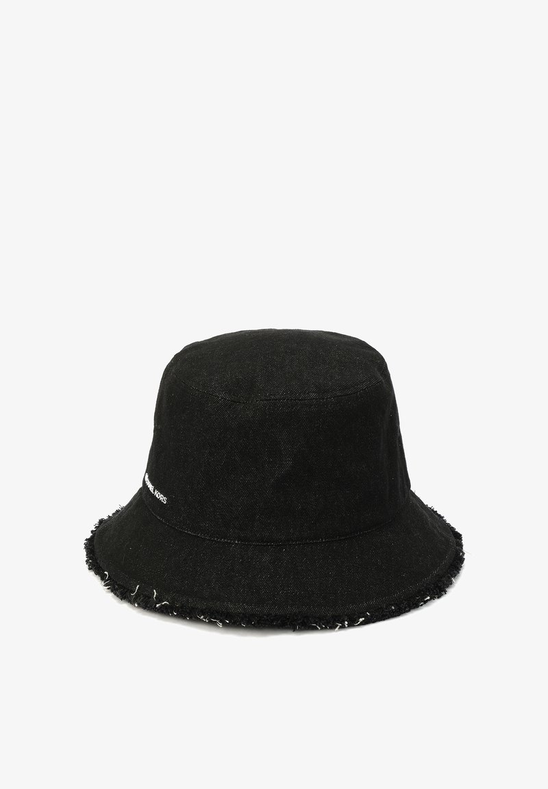 Black denim bucket hat with a frayed brim, featuring white logo detailing, cylindrical shape, and a textured fabric surface.