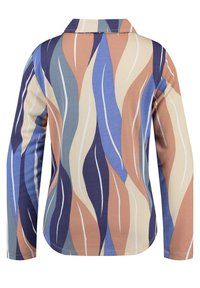 Långärmad skjorta med krage som har ett flerfärgat vågmönster i beige, blått och brunt på ett strukturerat tyg.