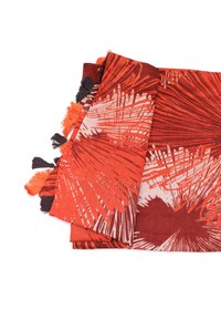 Tessuto patterned rosso e arancione con linee astratte, arricchito da nappine decorative in arancione, nero e bianco ai bordi.