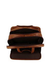 Brown leather backpack with multiple compartments, smooth texture, dual handles, and a deep brown interior. Zippered closures are visible.