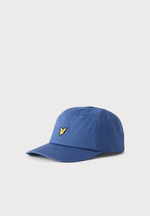 Gorra de béisbol azul con un logo de pájaro amarillo bordado en la parte delantera, mostrada sobre un fondo gris claro.
