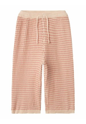Shorts da lounge rosa a trama waffle con vita a coste e lacci. Presentano una vestibilità ampia e una lunghezza fino a metà coscia per un comfort ottimale.