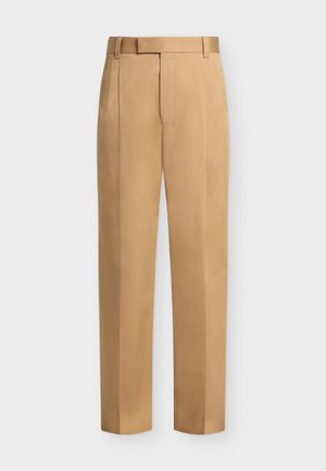 Pantaloni beige a gamba dritta con passanti per cintura, pinces frontali e chiusura con cerniera.