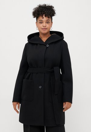 Black wool blend coat with a large hood, button closure, tied belt at the waist, and two front pockets. Smooth texture and tailored fit.