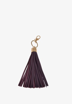 Porte-clés en cuir violet foncé orné de pampilles avec une capsule en métal doré, un anneau pour clés et un mousqueton.