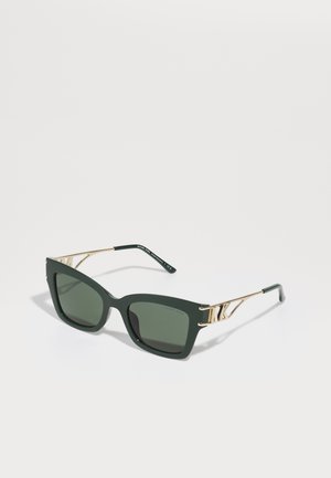 Green cat-eye sunglasses with dark lenses, gold accents, and metallic detailing on the temples. Matte finish on the frame adds texture.