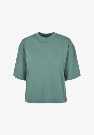 Short-sleeve, loose-fitting t-shirt in soft, muted teal cotton. Features a round neckline and straight hem with no visible patterns or accents.