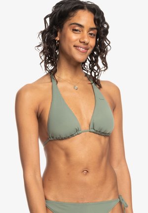 Green triangular bikini top with halter neck design and gathered sides. Made of smooth fabric, features minimal branding, paired with adjustable bottoms.