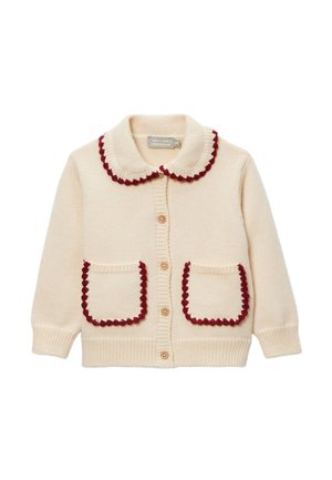 Cardigan en tricot crème avec bordure festonnée rouge sur le col et les poches, boutons en bois sur le devant, manches longues et poignets côtelés.