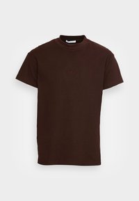 Dunkelbraunes Baumwoll-T-Shirt mit Rundhalsausschnitt, kurzen Ärmeln und dezent gesticktem "YPS"-Logo auf der Vorderseite. Schlichtes, strukturiertes Gewebe.