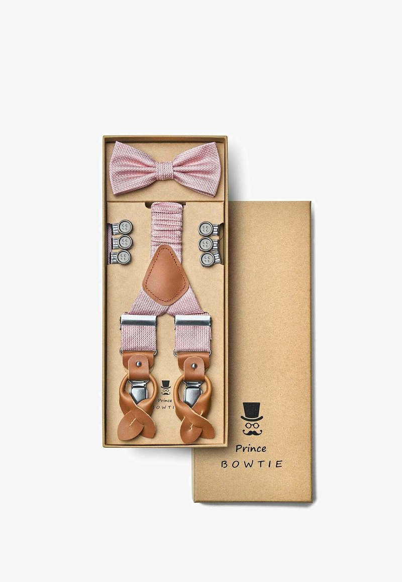 Pink fabric suspenders with leather accents and metal clips, paired with a matching pink bow tie, presented in a brown box.