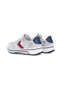 White and silver sneakers with a mesh upper, red and navy accents, rounded toe, and a textured rubber sole. Features a zip closure.