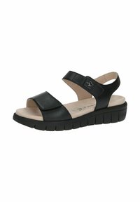 Mustad musta nahaga sandaalid, millel on kaks laia rihma, pehme beež vooder ja sooneline must kummitald, mis pakub kerget kõrguse tõusu.