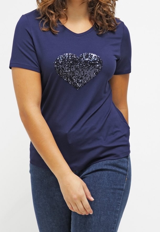 Navy blue T-shirt in a soft fabric featuring a sequin heart design on the front. Short sleeves and a V-neck cut.