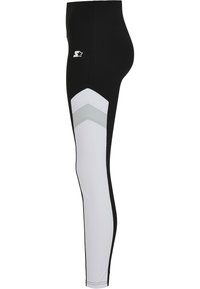 Czarno-białe legginsy z wzorem w zygzak; wykonane z elastycznego materiału. Posiadają logo oraz bezszwowy design po bokach.