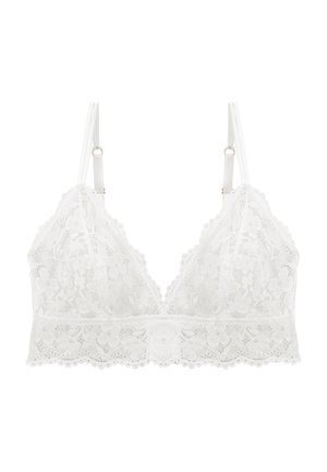 Bralette en dentelle blanche avec motif floral, bords festonnés, bretelles fines ajustables et décolleté en V profond.