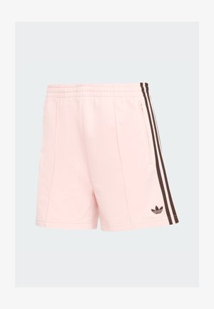 Pantalones cortos deportivos de color rosa claro con acabado texturizado, cintura elástica y bolsillo lateral con cremallera. Presentan rayas verticales marrón oscuro y logotipo.