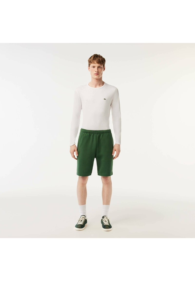 Lacoste Tracksuit bottoms vert fonce smi/dark green Zalando.de