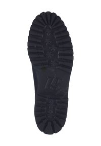 Zwarte rubberen schoenzool met diepe profielen en een ronde vorm, voorzien van een logo en een gestructureerd oppervlak voor grip.