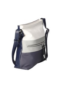 Sac bandoulière avec des sections bleu marine, gris clair et blanc, comportant une poche zippée externe et une bandoulière réglable bleu marine.