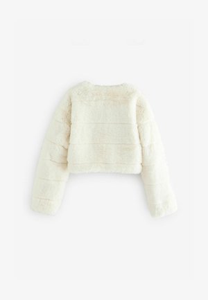 Kremasti lažni krzneni skraćeni kaput sa dugim, bujnim rukavima i teksturiranim rebrastim dizajnom. Ima okrugli izrez i nema zatvaranja.