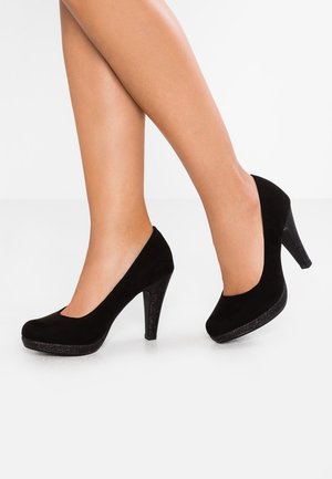 Black suede high heels with a rounded toe and a 10 cm glitter-covered stiletto heel. The shoes have a smooth texture and classic silhouette.