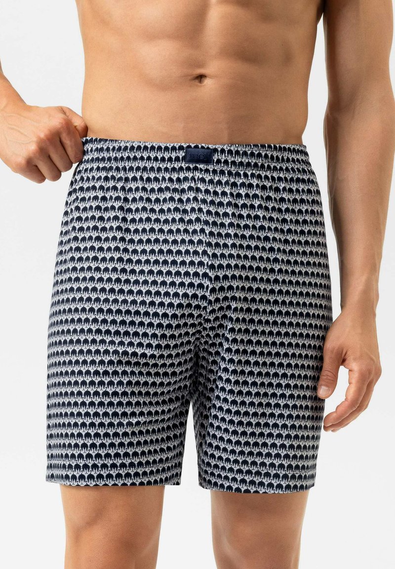 Marineblauwe en witte boxer shorts met een patroon van kleine olifanten, een elastische tailleband en een zachte, lichte stof die geschikt is voor casual aankleding.