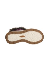 Bruine rubberen zool met een gestructureerd, zigzagpatroon. Het bovenste gedeelte is beige met een fuzzy accent. Al met al een duurzame en functionele ontwerp.