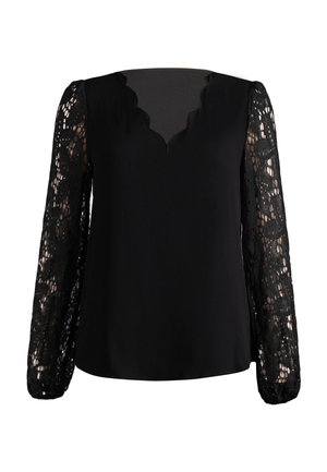 Blouse noire avec un col en V festonné et des manches longues en dentelle florale transparente avec des poignets élastiques.