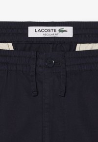 Lacoste Bukser - bleu marine hde